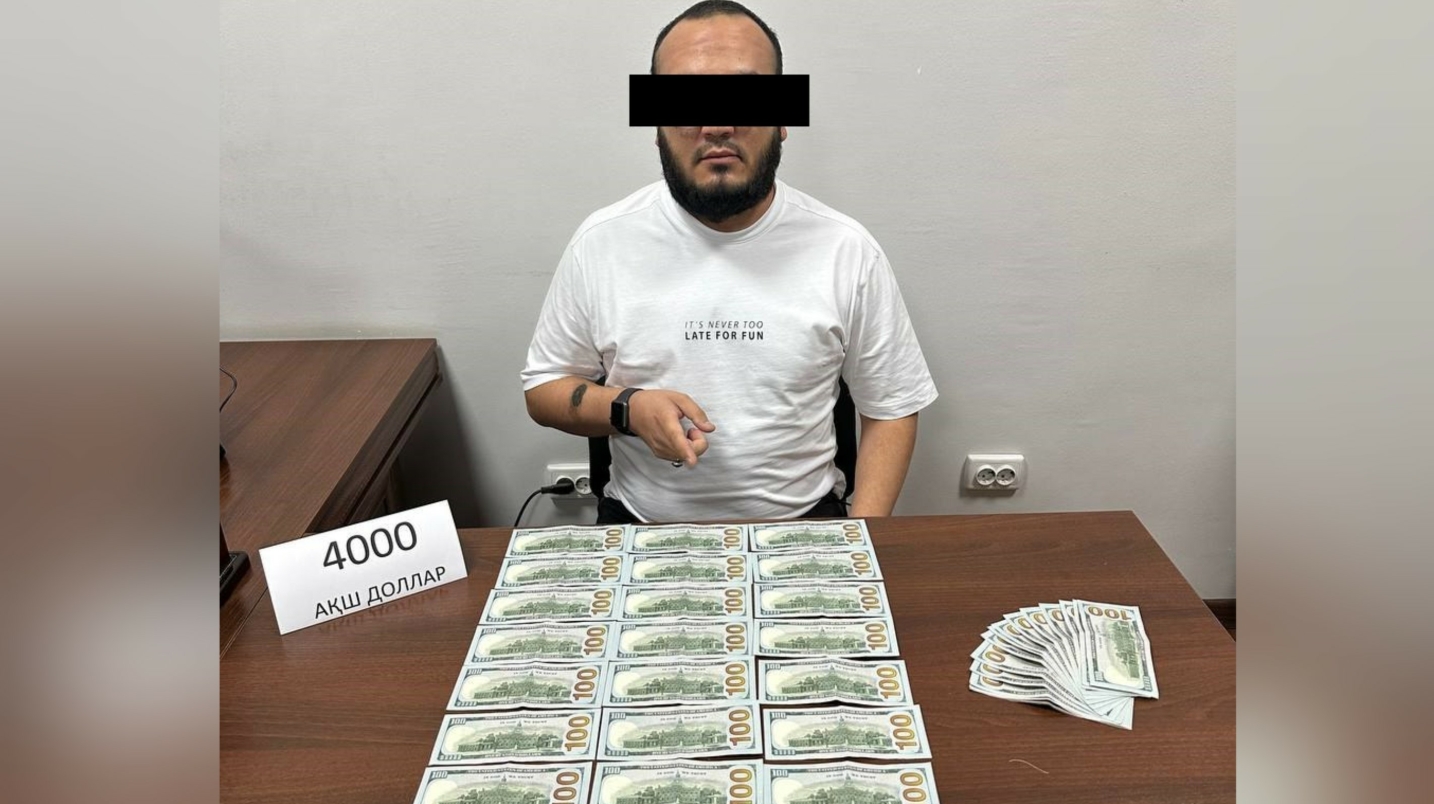 Тошкентда она ва болага $20 минг эвазига “Ҳаж визаси” қилиб бермоқчи бўлган икки шахс ушланди